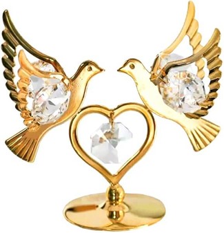 Et guldbelagt hjerte og to duer dekoreret med Swarovski-krystaller
