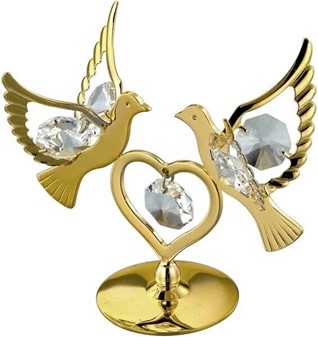 Et guldbelagt hjerte og to duer dekoreret med Swarovski-krystaller