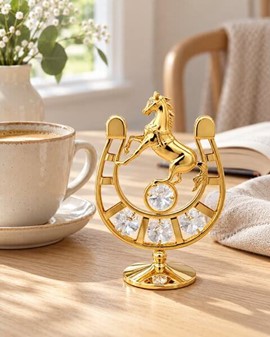 Forgyldt hestesko med Swarovski-krystaller. For heldigvis